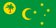 green with a yellow crescent, a yellow circle and palm tree, and a yellow southern cross