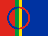 blue with a thick red stripe outlined in green and yellow on the left, with a blue and red ring